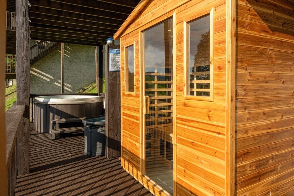 Cedar sauna and hot tub on the spa deck at a Mars Hill cabin with hot tub access