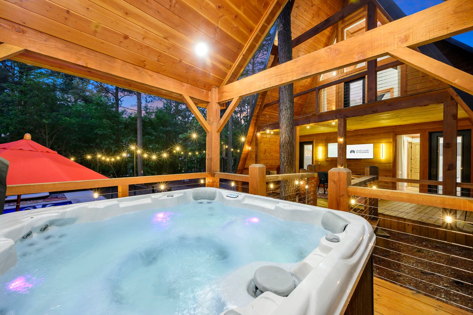 Private outdoor hot tub on a covered deck at Wolf and Wander in Mars Hill, NC
