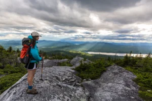 Hiker checking trail conditions near the Appalachian Trail before a hot tub and sauna Hatley Pointe evening
